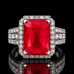 Emerald Cut Red Gemstone Halo Ring with Blue and Clear Stone Accents